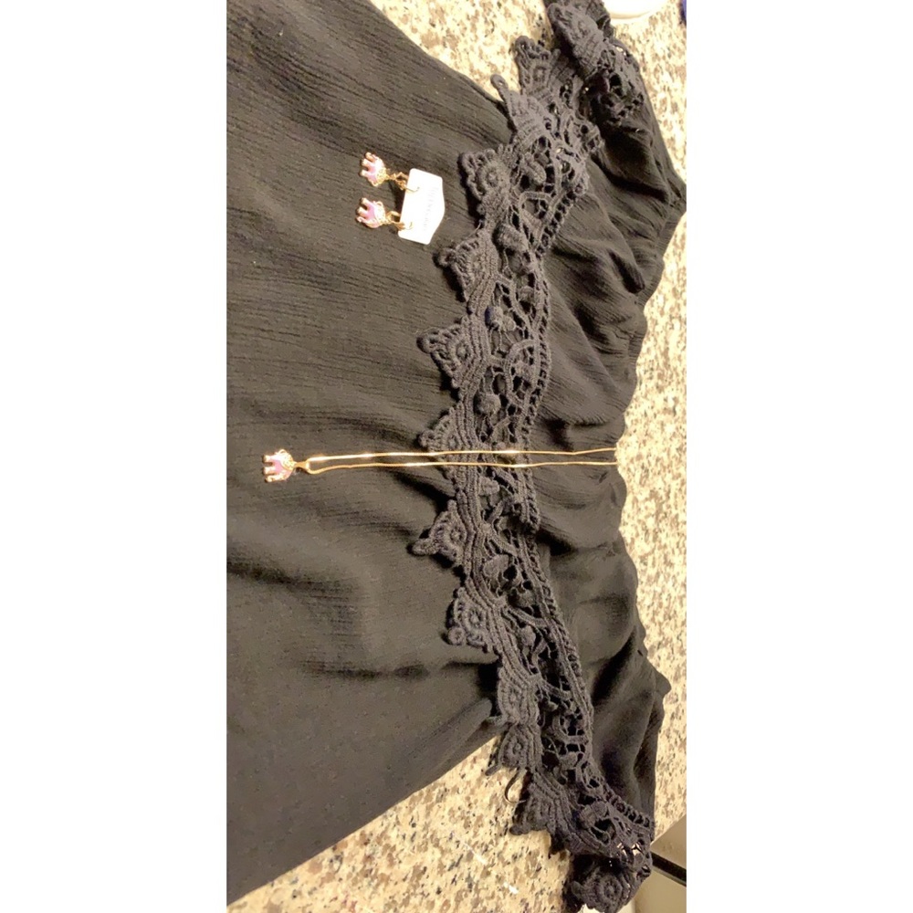 Cuts off the shoulder black top